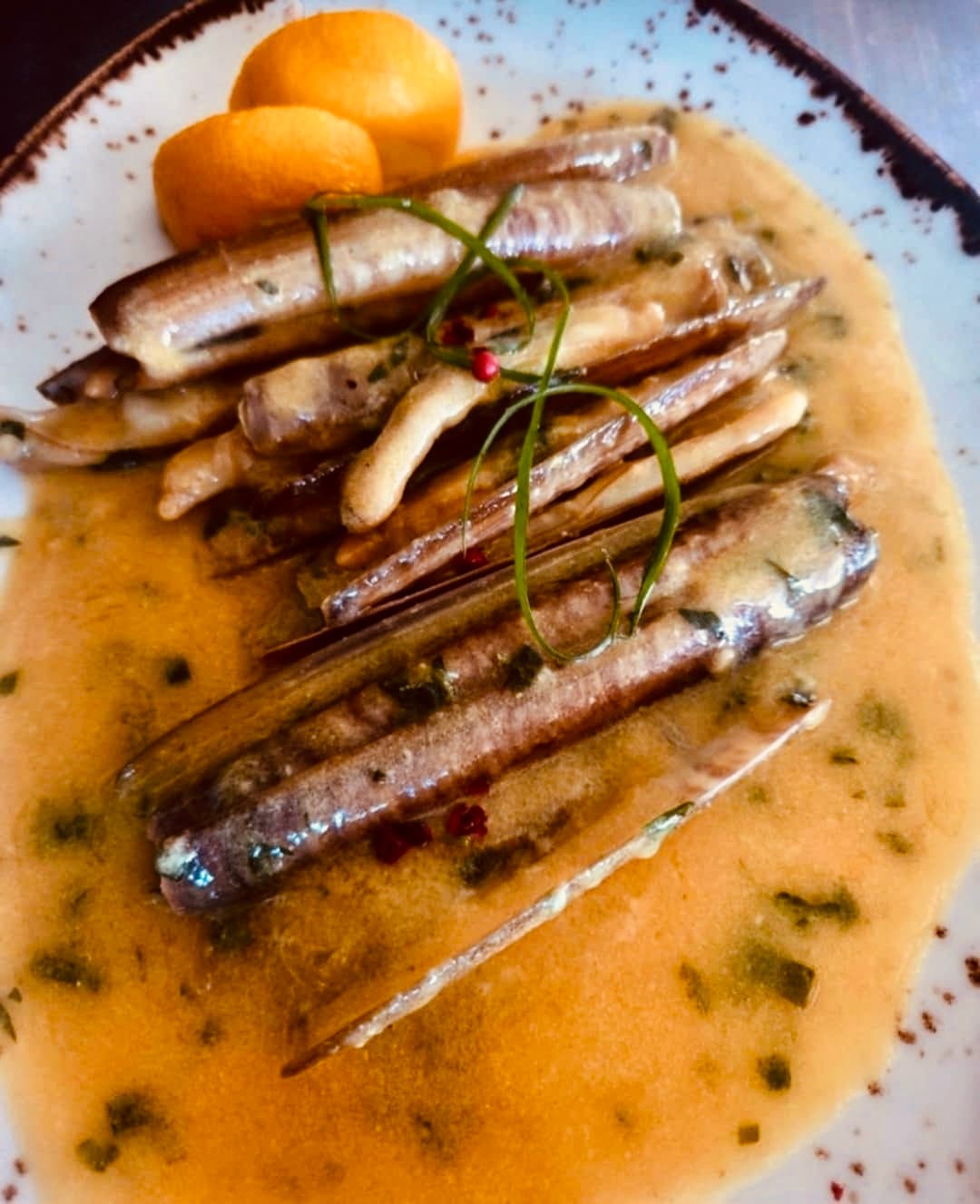 Fresh razor clams beautifully plated